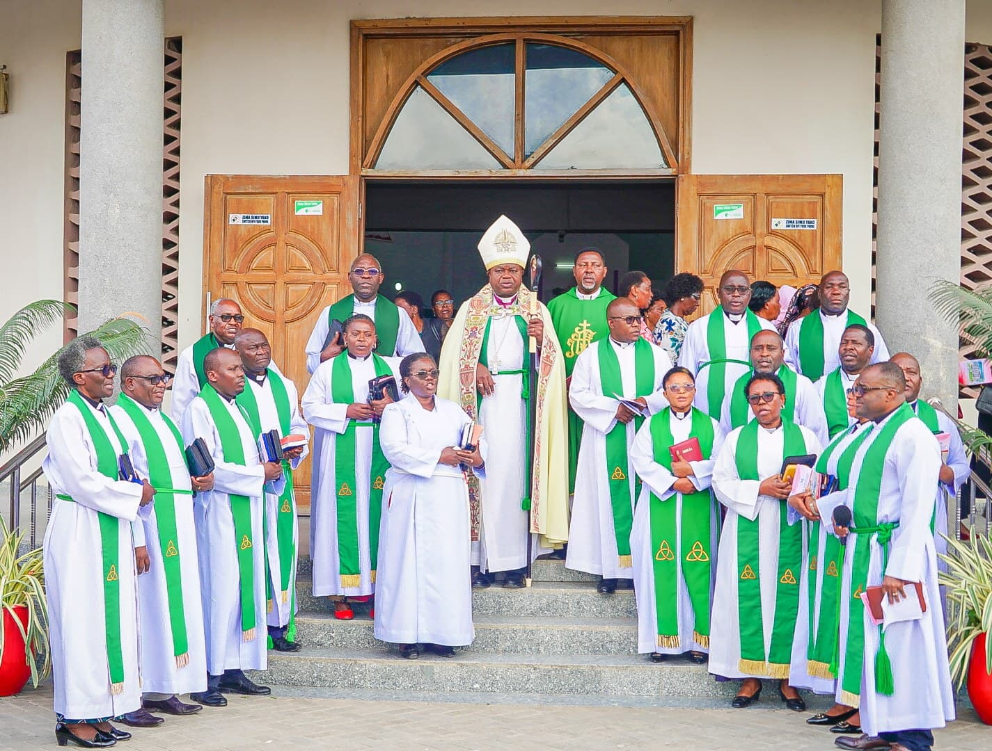 The bishop and the clergy of Mbezi Luis on the church steps after a service