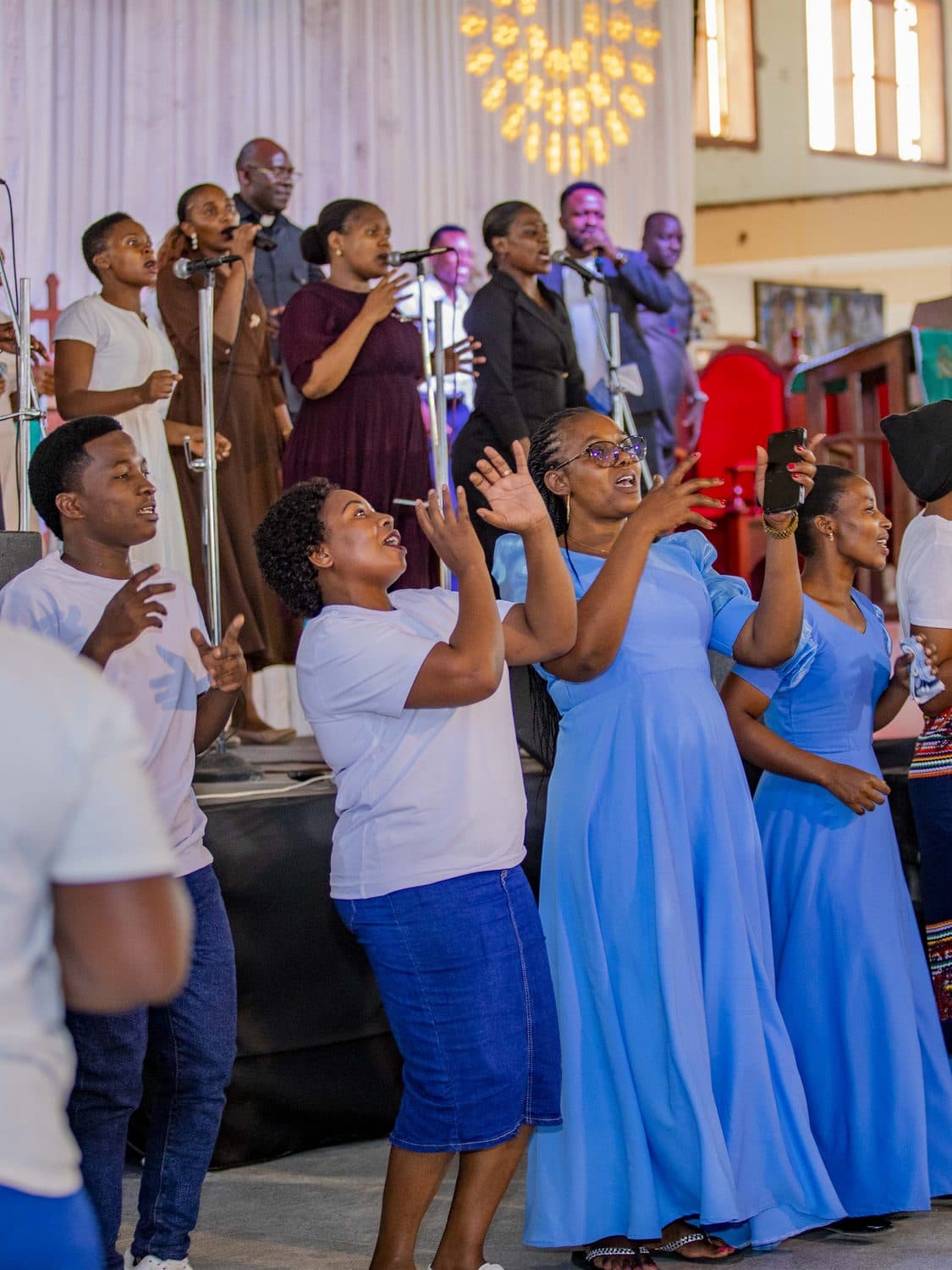 The congregation of KKKT Mbezi Luis singing in worship